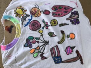 How To Talk To Your Child About Their Artworks Positively & Artfully, doodling on a tee shirt